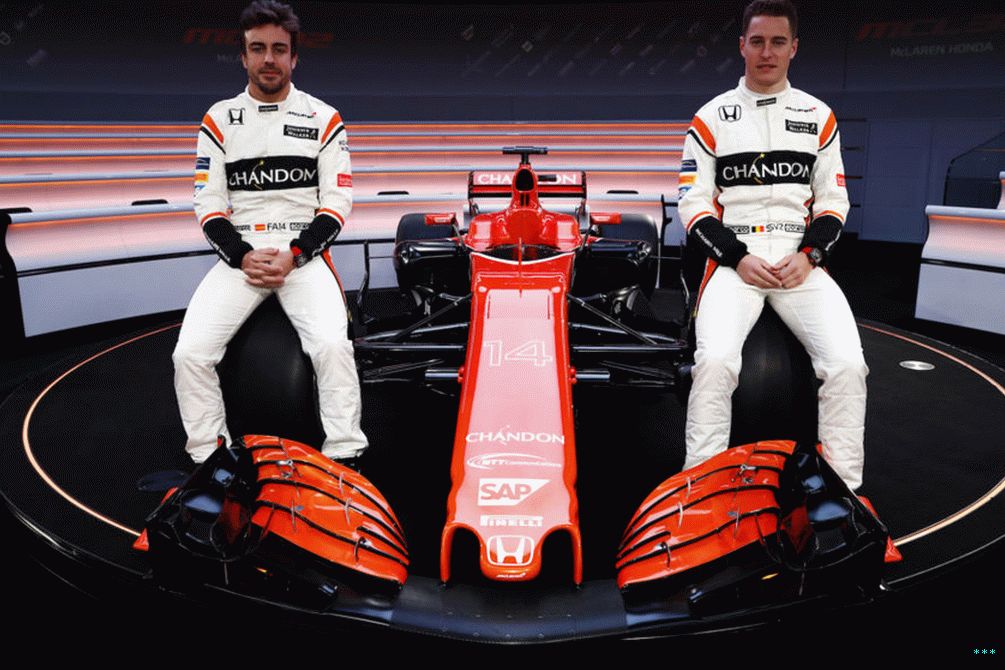 Fernando Alonso (L) and Stoffel Vandoorne (R) either side of their 2017 car, the MCL32.